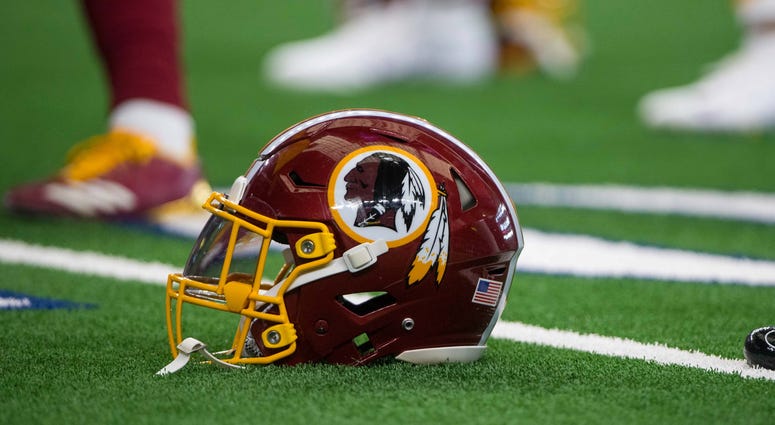 A Washington Redskins helmet sits on the field. Redskins_Helmet