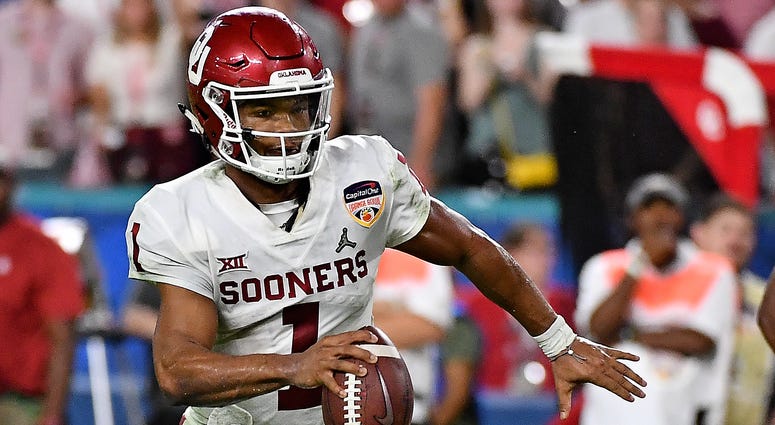 Kyler Murray scrambles away from Alabama defenders during the 2018 Orange Bowl Kyler Murray chooses football