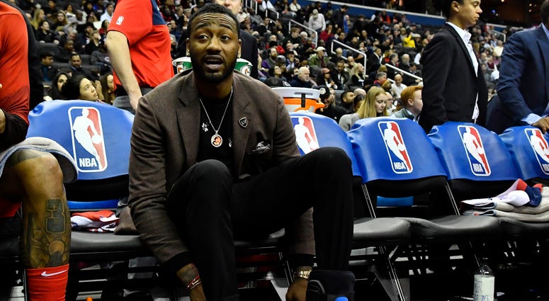 John Wall watches from the Wizards bench while recovering from heel surgery John Wall ruptures Achilles recovering from season-ending heel surgery