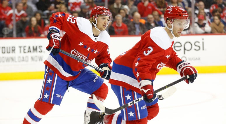 New Capitals teammates Carl Hagelin (62) and Nick Jensen (3) skate in Sunday's 6-5 win over the Rangers Capitals trade deadline report card