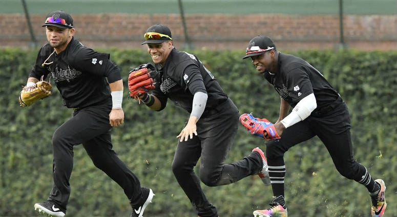 Nationals outfielders race in after finishing a sweep of the cubs. Nationals stay hot with sweep of Cubs