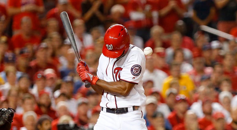 Michael A. Taylor hit by pitch in the bottom of the 8th. PHOTOS: Stay in the fight! Nats beat Brewers in Wild Card
