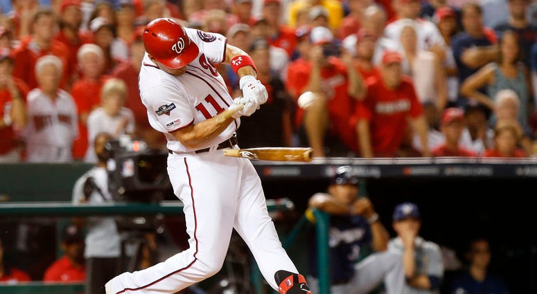 Ryan Zimmerman gets a two-out broken back hit. PHOTOS: Stay in the fight! Nats beat Brewers in Wild Card