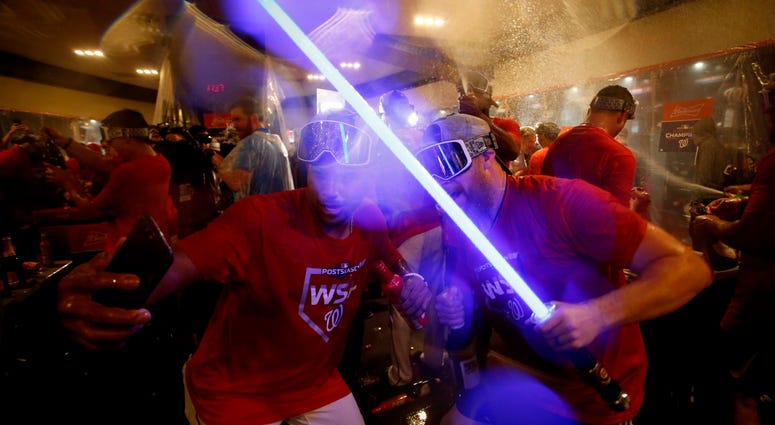 Sean Doolittle, lightsaber in hand, celebrates the win. PHOTOS: Stay in the fight! Nats beat Brewers in Wild Card