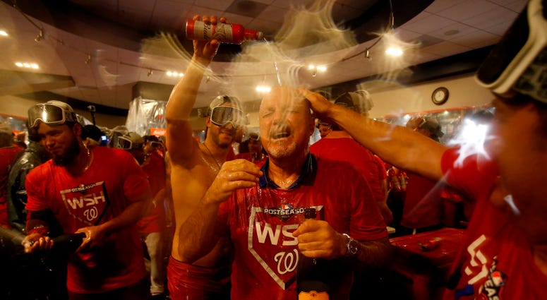 Nats GM Mike Rizzo enjoying himself. PHOTOS: Stay in the fight! Nats beat Brewers in Wild Card