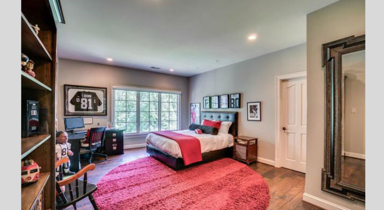 A Redskins-themed bedroom inside Bruce Allen's home. Bruce Allen's McLean, Virginia mansion is up for sale again.