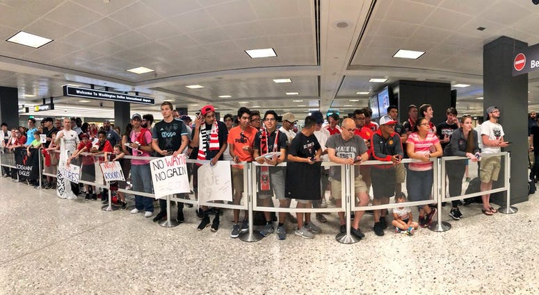 DC United fans await Wayne Rooney's arrival at Dulles Airport Wayne_Rooney_Dulles_Airport