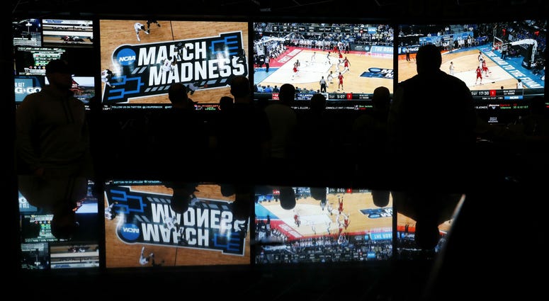 People watch NCAA Tournament coverage at a sports book in Las Vegas Westgate_Superbook_Las_Vegas