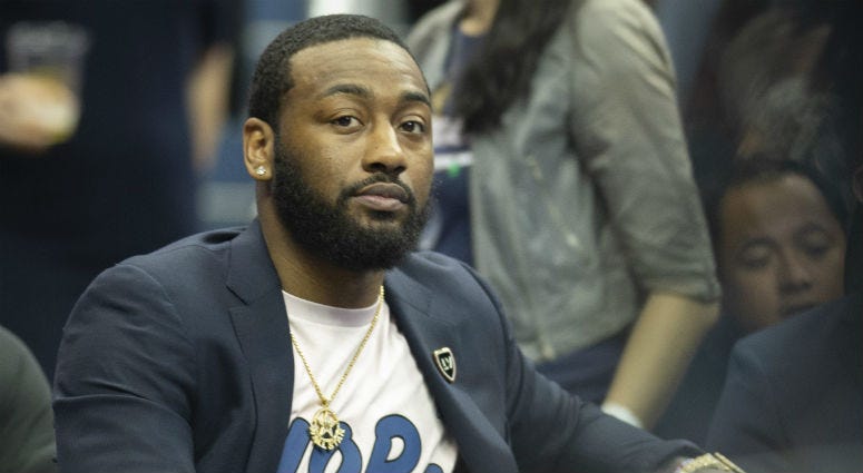 Injured Wizards guard John Wall sits on the bench during an April game. Wizards PG John Wall on the bench