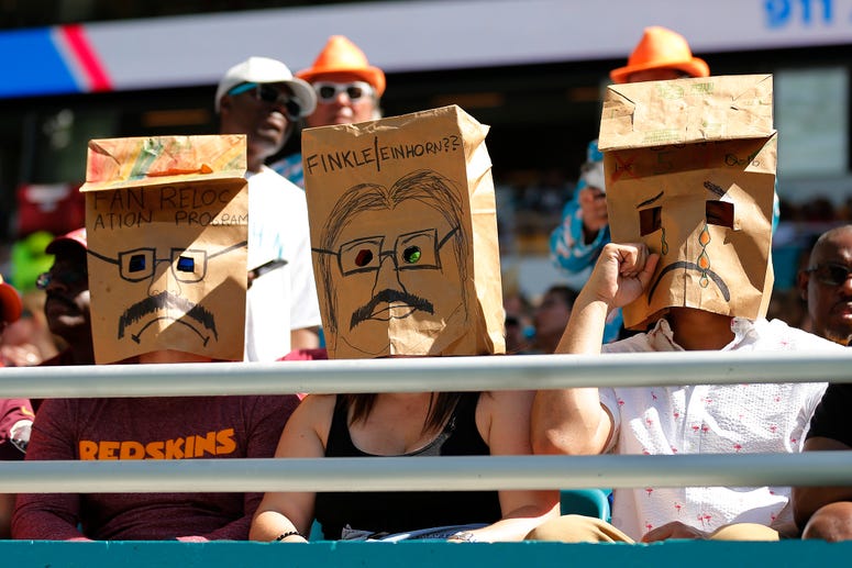Redskins fans go incognito. Redskins fans hide faces, protest Bruce Allen in Miami