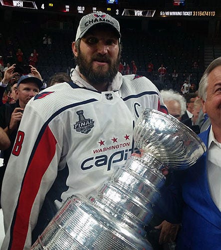 Alex Ovechkin and the Stanley Cup Alex Ovechkin grips the Stanley Cup just minutes after winning it.