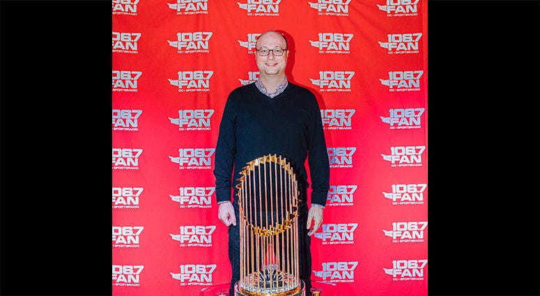 106.7 The Fan Program Director Chris Kinard poses with the World Series trophy 106.7 The Fan Program Director Chris Kinard poses with the World Series trophy