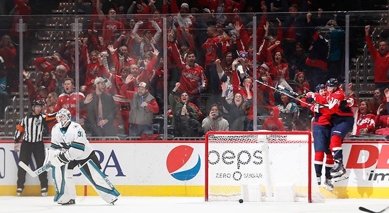 Lars Eller celebrates with John Carlson after scoring the OT game-winner after an improbable comeback against the San Jose Sharks 'No-quit mentality' fueled Caps' unfathomable comeback vs. Sharks