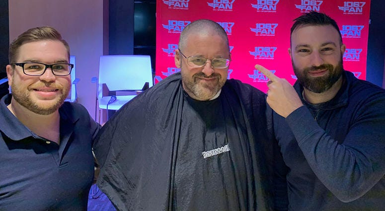 Chris Russell made a bet with Grant & Danny that the Redskins would win more than six games this season. He lost. So Russell had his head shaved, on air, on Thursday, December 12. WJFK-FM’s Chris Russell with Danny Rouhier and Grant Paulsen. Russell lost a bet and then lost his hair on the air on Thursday, December 12.
