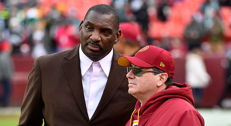 Doug Williams speaks with Redskins owner Dan Snyder before a game in December 2018 Redskins hire former Panthers executive Rob Rogers, announce new role for Doug Williams amid sweeping front office changes