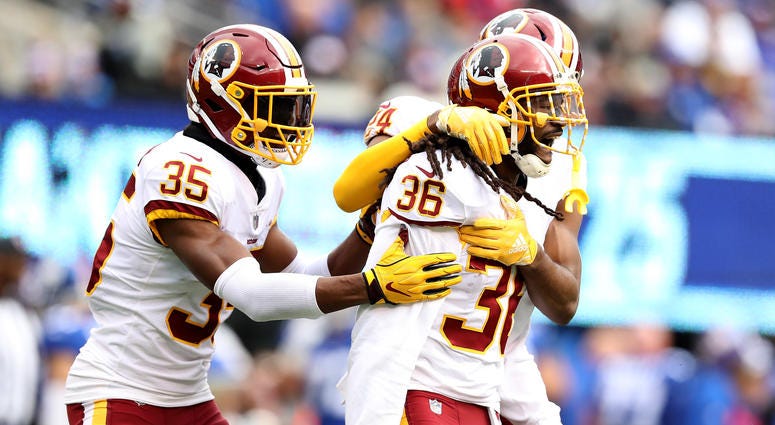 Swearinger celebrates with Redskins teammates after picking off Eli Manning DJ_Swearinger_two_interceptions
