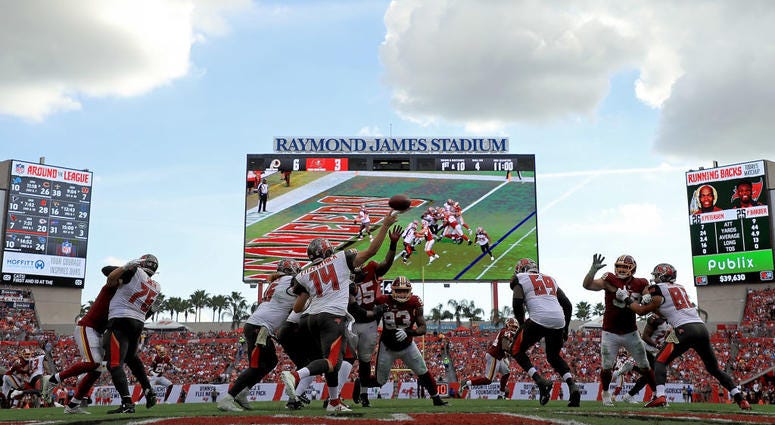 Ryan Fitzpatrick passes against the Redskins defense at Raymond James Stadium in Tampa on Sunday. The Redskins won 16-3. Redskins_Buccaneers