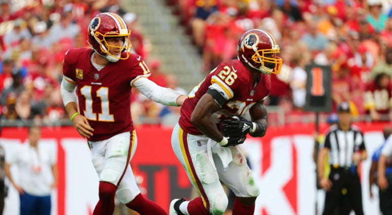Redskins QB Alex Smith hands off to Adrian Peterson in a 16-3 win against Tampa Bay Alex_Smith_Adrian_Peterson