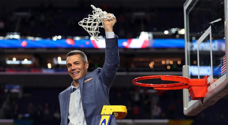 Virginia head coach Tony Bennett celebrates cutting down the nets. Tony_Bennett