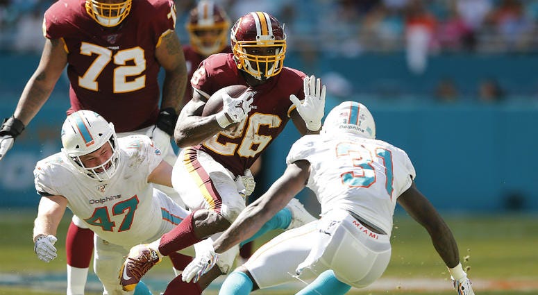 Adrian Peterson ran for over 100 yards in Redskins 1st win. Redskins get first win against dreadful Dolphins