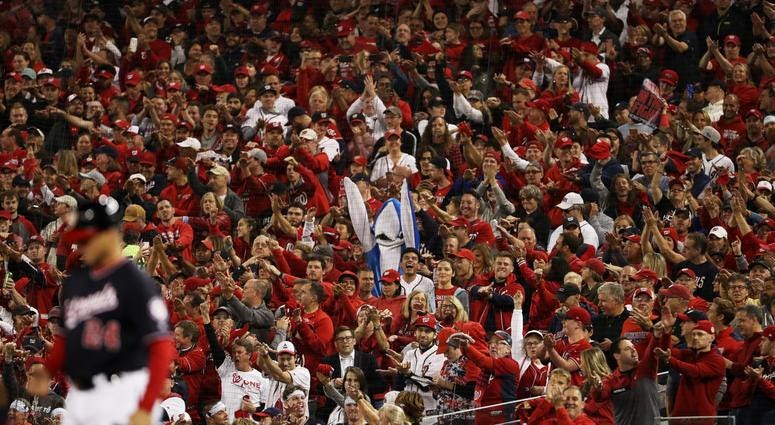 Will there still be shark costumes in 2020? A fan dressed as a shark cheers as Gerardo Parra in the NLCS.