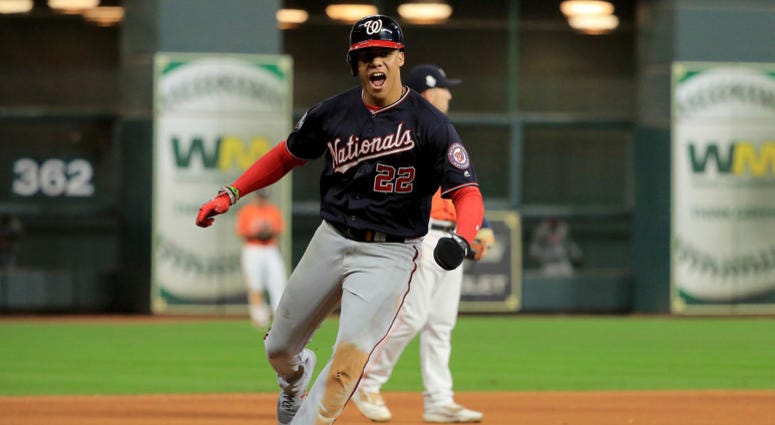 Juan Soto celebrates as he rounds the bases following Howie Kendrick's game-altering home run. Juan Soto #22 of the Washington Nationals celebrates as he comes home to score a run on a home run by Howie Kendrick (not pictured) against the Houston Astros during the seventh inning in Game Seven of the 2019 World Series.