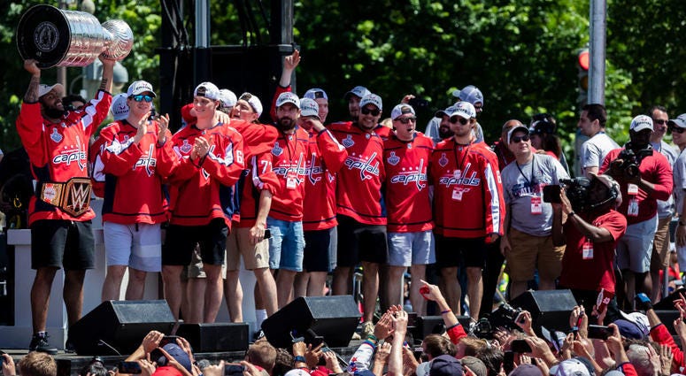 Wearing the title belt, Devante Smith-Pelly hoists the Stanley Cup Devante_Smith_Pelly_Championship_Belt