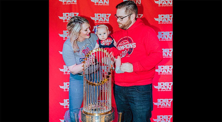 106.7 The Fan host Grant Paulsen and family pose with the World Series trophy 106.7 The Fan host Grant Paulsen and family pose with the World Series trophy