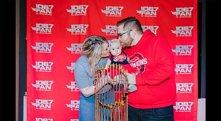 106.7 The Fan host Grant Paulsen and family pose with the World Series trophy 106.7 The Fan host Grant Paulsen and family pose with the World Series trophy