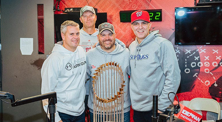 The Sports Junkies pose with the Commissioner's Trophy The Sports Junkies pose with the Commissioner's Trophy