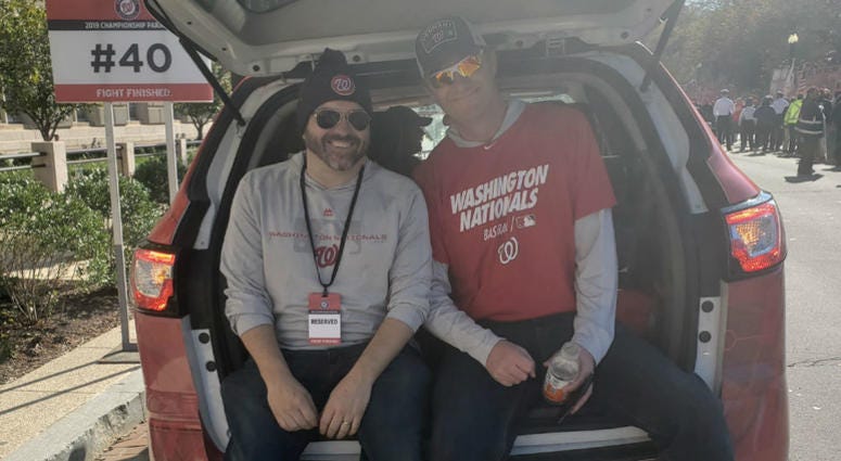 Cakes and Bish just chillin' in the back of a station vehicle before the Nationals parade. The Sports Junkies of WJFK-FM take part in the Washington Nationals victory parade in Washington, D.C. on Saturday, November 1.