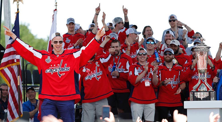 Capitals center Lars Eller (20) waves to the crowd while being introduced during the Stanley Cup championship parade and celebration on the National Mall. Lars Eller - Washington Capitals