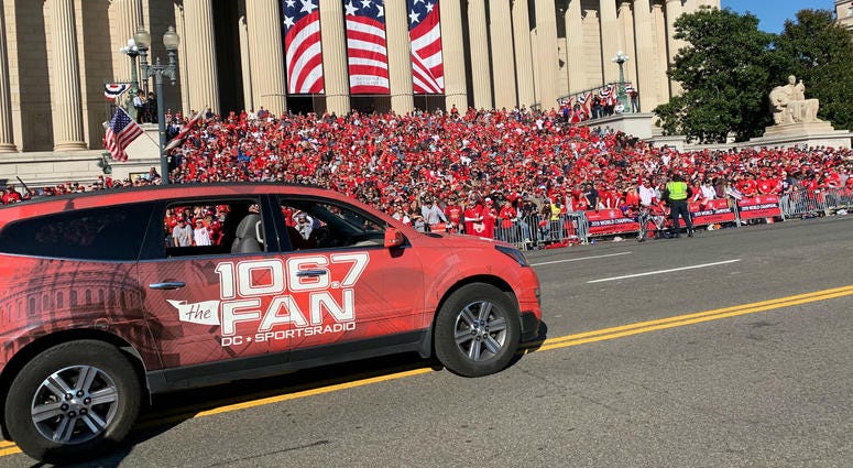 It was a big day for 106.7 The Fan and its personalities at the Nationals victory parade. A 106.7 The Fan station vehicle drives through the Washington Nationals parade on Saturday, November 1.