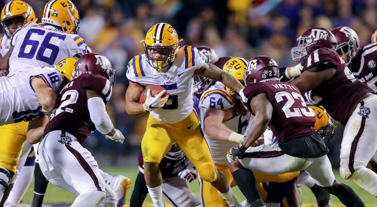 Derrius Guice takes on two Texas A&M defenders Derrius_Guice_LSU