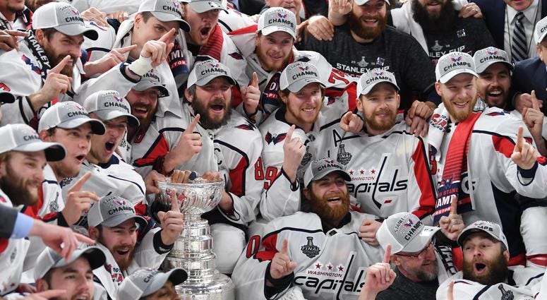 Top 10 D.C. Sports Moment: The Caps Stanley Cup win. Washington Capitals players pose for a team photo with the Stanley Cup