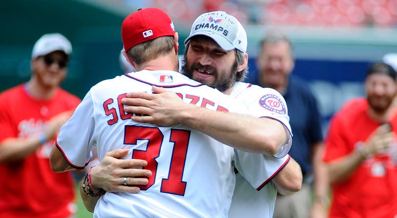 Alex Ovechkin and Max Scherzer embrace. D.C. athletes came out to support Capitals in Stanley Cup Playoffs.