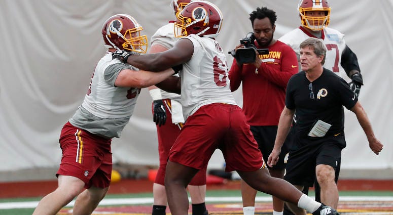 Bill Callahan works with his offensive linemen at Redskins Park Hoffman: Bill Callahan partially to blame for offensive line injuries