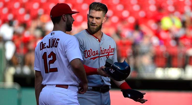 Bryce Harper talks with Paul DeJong of the St. Louis Cardinals. Bryce_Harper_Paul_DeJong