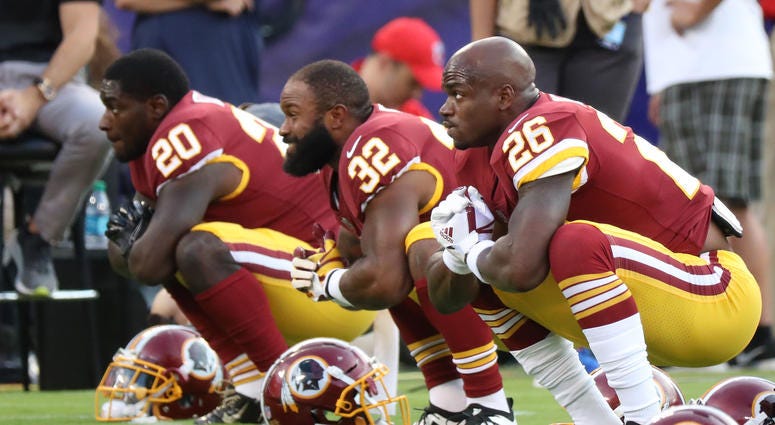 Rob Kelley, Samaje Perine and Adrian Peterson stretching. Redskins_Running_Backs