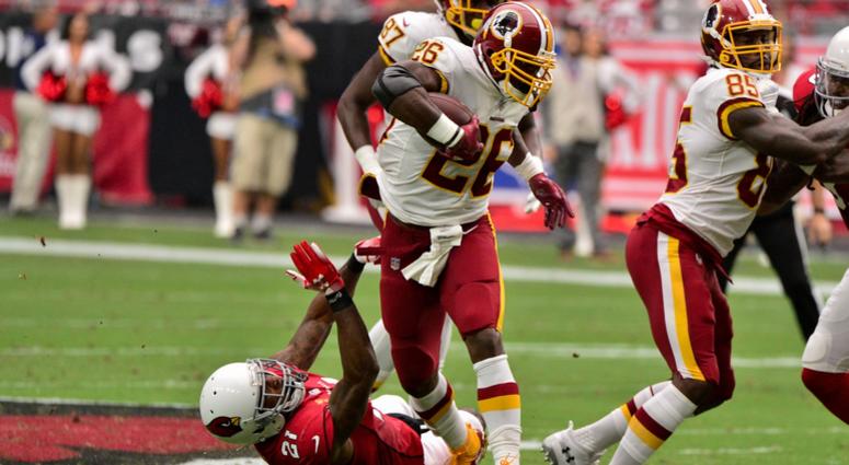 Adrian Peterson breaks a tackle by Patrick Peterson Adrian_Peterson_Redskins