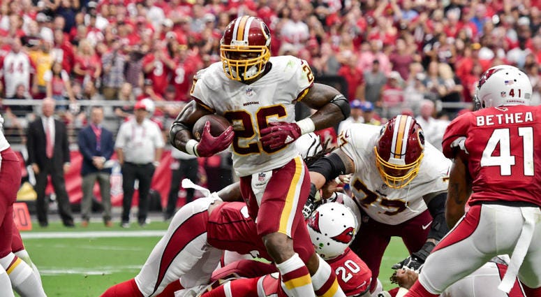 Adrian Peterson scores a touchdown in Arizona. Adrian_Peterson_Redskins