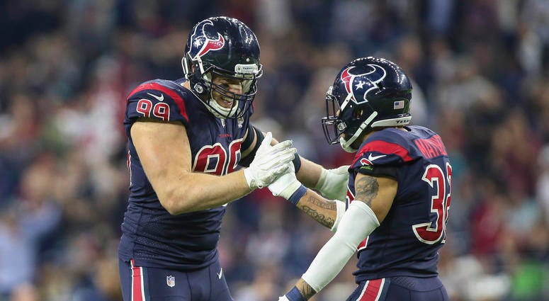 J,J. Watt and Tyrann Mathieu celebrate after making a play against the Dolphins JJ_Watt_Tyrann_Mathieu