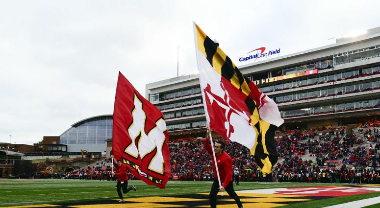 Maryland Terrapins cheer team celebrate after a score. University_Maryland_Football