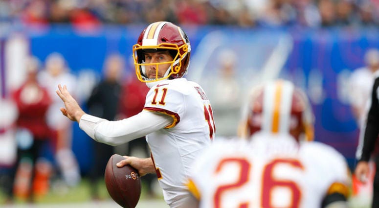 Redskins QB Alex Smith looks for Adrian Peterson. Alex_Smith_Peterson_Redskins