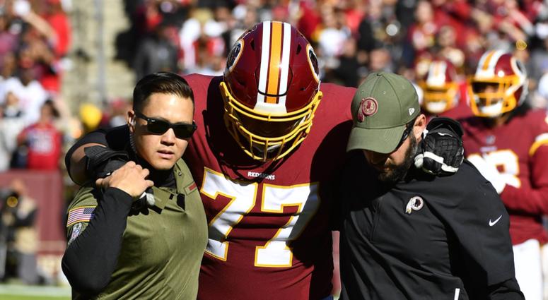 Shawn Lauvao helped off the field. Shawn_Lauvao_Injury