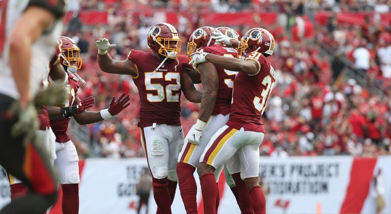 Redskins players celebrate forcing a turnover. redskins_players_celebrate