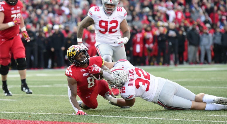 A Maryland football player dives for the end zone. Maryland_Terps_Football