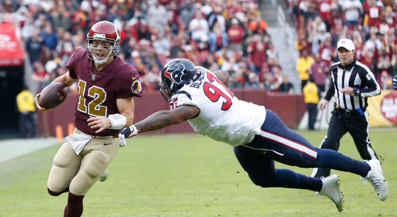 Colt McCoy carries the ball for the Washington Redskins. Colt_McCoy
