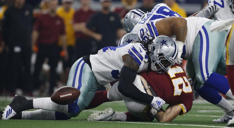 Colt McCoy fumbles against the Dallas Cowboys. Colt_McCoy_Fumble