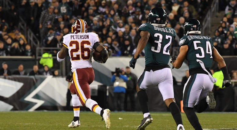 Adrian Peterson gallops for a 90-yard touchdown against the Eagles in December Adrian Peterson returns to Redskins on two-year deal